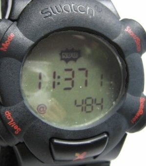 A Swatch branded digital watch with metric and Internet time